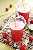 Coconut juice, lime, strawberry and raspberry smoothie