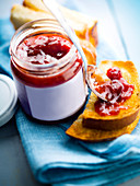Slices of toasted brioche, strawberry and wild strawberry jam