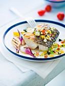 Piece of cod with thinly chopped vegetables