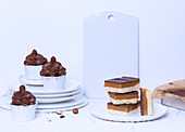 Millionaire's slices and chocolate cupcakes with praline cream