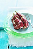 Plate of fresh figs with thinly sliced almonds