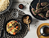 Couscous with meat and vegetables, lamb mince skewers from the grill