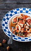 Squid with tomato sauce and spinach