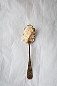 Almond powder on an antique spoon