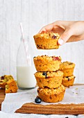 Stack of turmeric and blueberry muffins