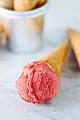 Strawberry ice cream in waffle cones