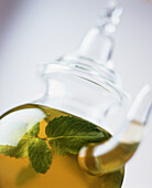Peppermint tea in a glass jug