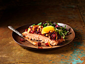 Scottish salmon steak with cranberries, orange and salad