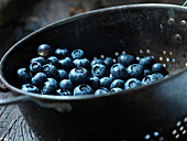 Sieve with blueberries