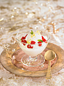 Yoghurt cream with lemon sorbet with summer fruit and mint flakes