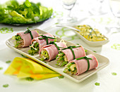 Ham rolls garnished with chopped artichoke bases, lettuce and beansprouts