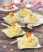 Celeriac remoulade nests garnished with crab meat