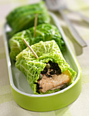 Salmon,capers and thinly sliced black olives cooked in cabbage leaves