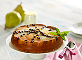 Moist pear and yoghurt cake decorated with chocolate chips