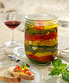 Jar of grilled peppers in olive oil