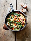 Cook rice, vegetables, chorizo and beaten eggs in a pan