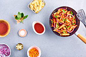 Penne, tomato sauce and Thai-basil wok