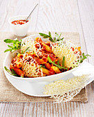 Penne with tomato sauce, rocket lettuce and parmesan tuiles