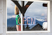 Neon sign 'OPEN' in a window, Alaska, USA