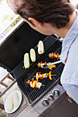 Young man from behind at a barbecue