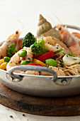 Pasta with shrimps, whelks and vegetables