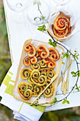 Two different pesto Palmiers for an aperitif outdoors