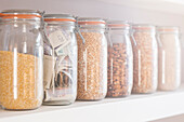 Jars of dried fruit, cereals and banknotes