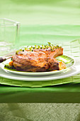 Veal chop grilled with Espelette pepper-flavored salt and fresh thyme, pan-fried vegetables
