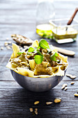 Farfalle with pesto,pine nuts and squash seeds