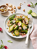 Brussels sprout,radish and cashew salad with turmeric vinaigrette