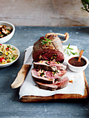 Roast venison with spices and walnuts, quinoa salad, roasted mushrooms with herbs