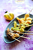 Gambas trio,coated with crushed pistachios,with almond and with hazlnuts
