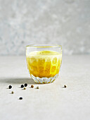 Boost shot with coconut water, ginger, turmeric and pepper