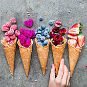 Composition with cones filled with summer berries