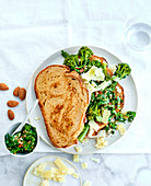 Veggie sandwich with broccolini, parmesan shavings and almond slivers