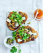 Toasted bread with aubergine, Manouri cheese, coriander and pistachios (vegetarian)