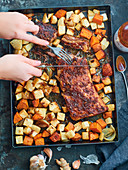 Baking tray : Roasted pork spare ribs with ginger,celeriac and sweet potatoes