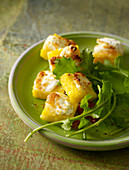 Diced polenta grilled with goat's cheese