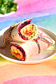 Rainbow hummus and vegetable vegetarian wrap