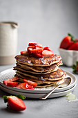 Pancakes with vanilla sauce and fresh strawberries