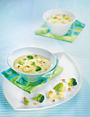 Cream of cauliflower, broccoli and romanesco with roasted hazelnuts