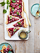 Rhubarb and raspberry rectangular pie with peach coulis
