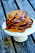 Stacked pancakes with maple syrup