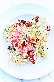 Endive salad with walnuts and maple syrup and roast beef carpccio
