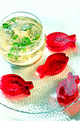 Raspberry jelly Easter fish and a small table aquarium