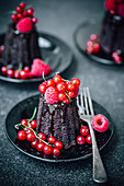 Mini chocolate cakes with red berries