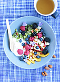 Fromage blanc with fresh fruit salad,almonds and flowers