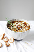 Miso soup with noodles and two types of mushrooms