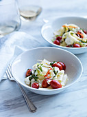 Pappardelle salad with feta and mozzarella cheese, pigeon heart tomatoes and fresh herbs