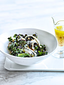 Kale salad with ricotta, anchovies and pine nuts